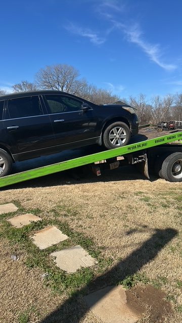 Draggin' Wagons Towing flatbed loaded with an SUV in Durant, OK